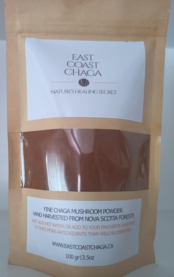 A small bag filled with dark, finely ground East Coast Chaga powder.